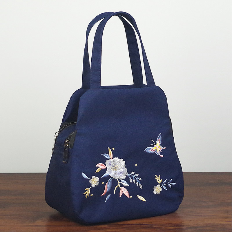 女包新款绣花包中老年妈妈包民族风帆布包休闲逛街手提包小包包女