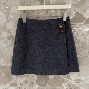 2025秋冬新款钉扣简约气质灰色毛呢A字裙短裙不规则设计感半身裙