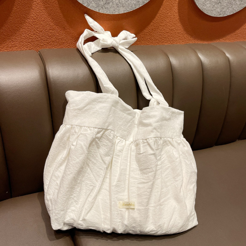 春夏简约百搭单肩包少女甜美大容量帆布包慵懒风褶皱裙系带女包