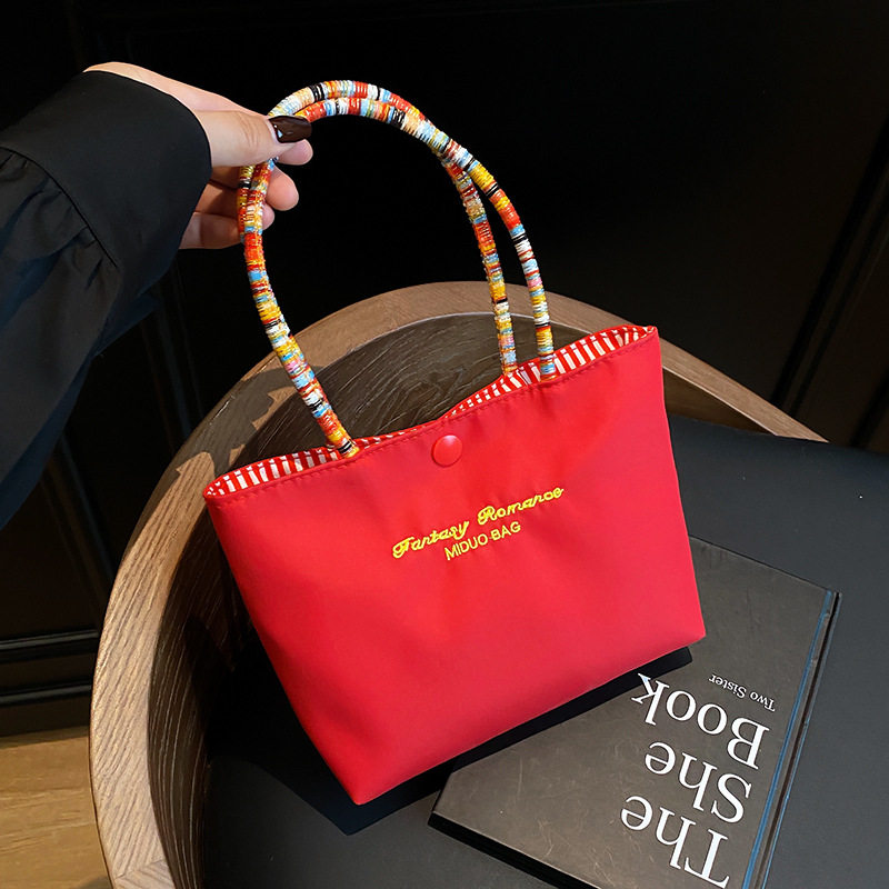 韩系帆布包小众手提包便携彩绳手提吸睛撞色补妆实用外出单肩包