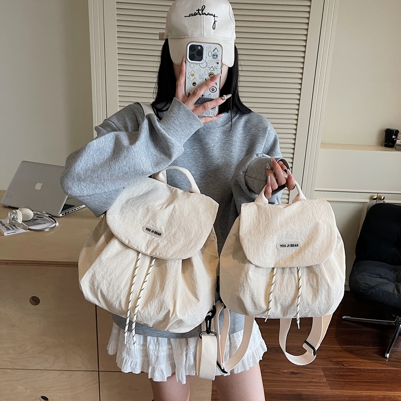 机能风尼龙防泼水书包初中女生高中生男休闲学生党双肩包旅游度假