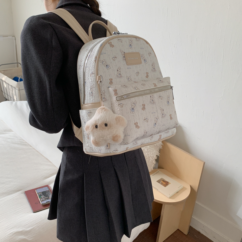 旅行双肩包女2025新款大容量大学生通勤高级感小众可爱印花书包潮