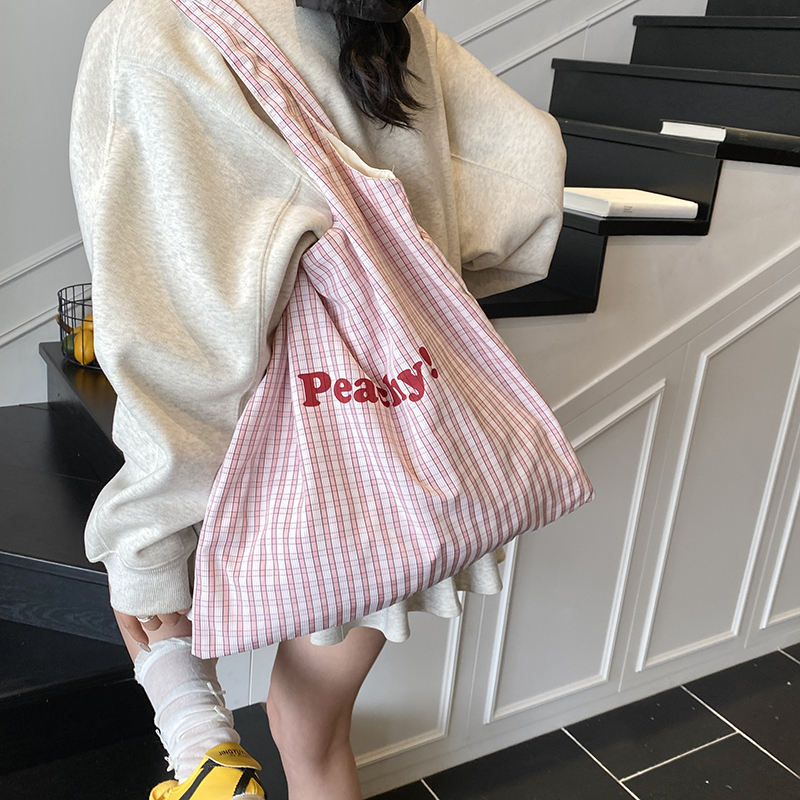 慵懒松弛感包包女大容量2025新款休闲学生党上课帆布包条纹通勤包