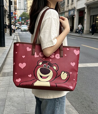 迪士尼新款大容量托特包包女大号卡通草莓熊三眼仔手提腋下单肩包