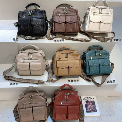 沐卡里羊皮多口袋休闲女包双肩背