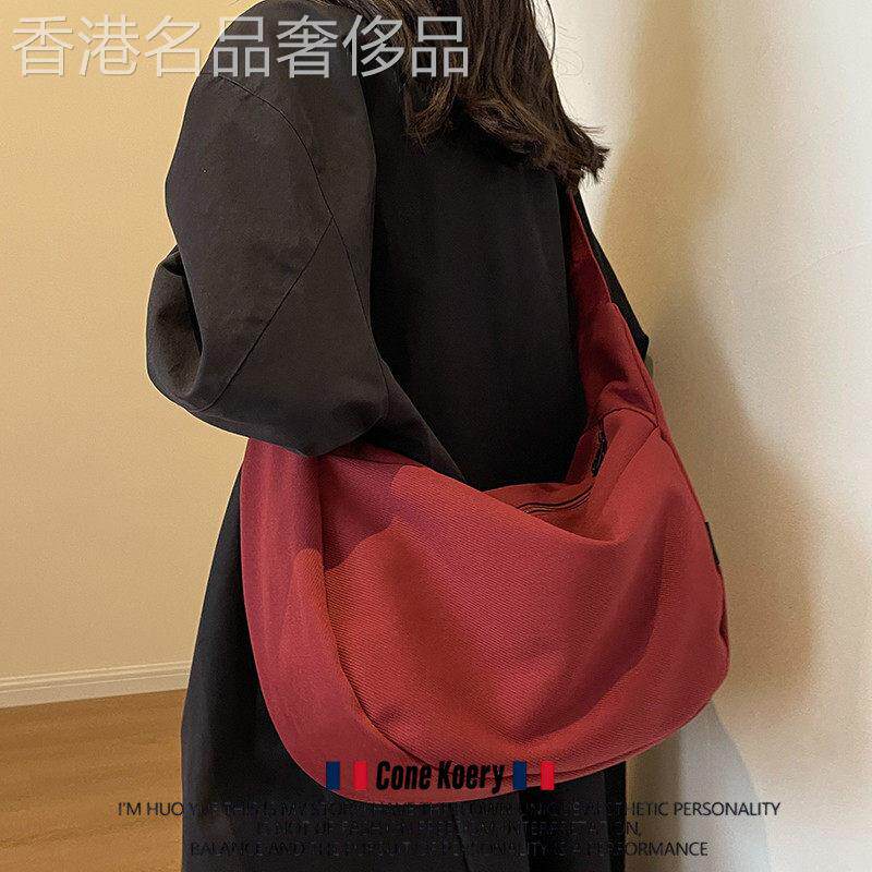 法国大容量帆布包包百搭设计感斜挎包男女大学生单肩包通勤水饺包