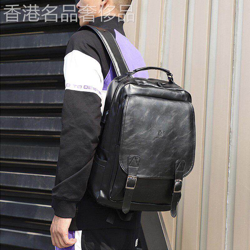 真皮复古双肩包男新款英伦大容量USB充电户外电脑包休闲旅行揹包