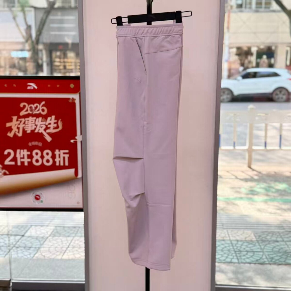 安踏运动2026春季女裤综训宽松工装长裤轻暖绒梭织长裤162617505