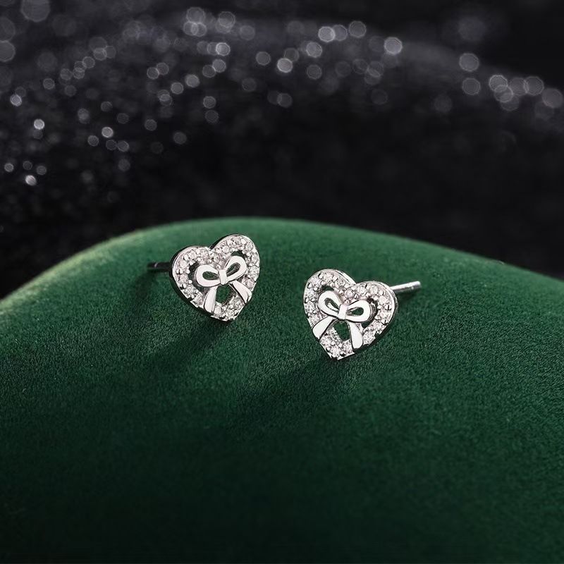 爱心蝴蝶结耳钉女s999纯银轻奢高级感小众百搭学生耳环夏季饰品