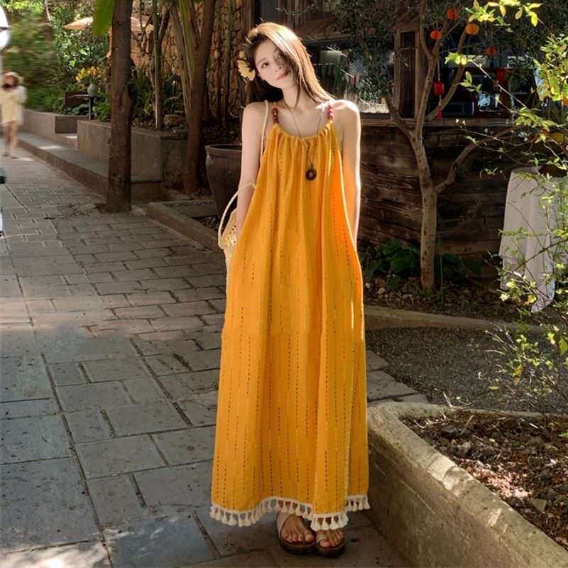 云南旅游穿搭女装黄色流苏吊带显白连衣裙度假气质长裙绝美沙滩裙