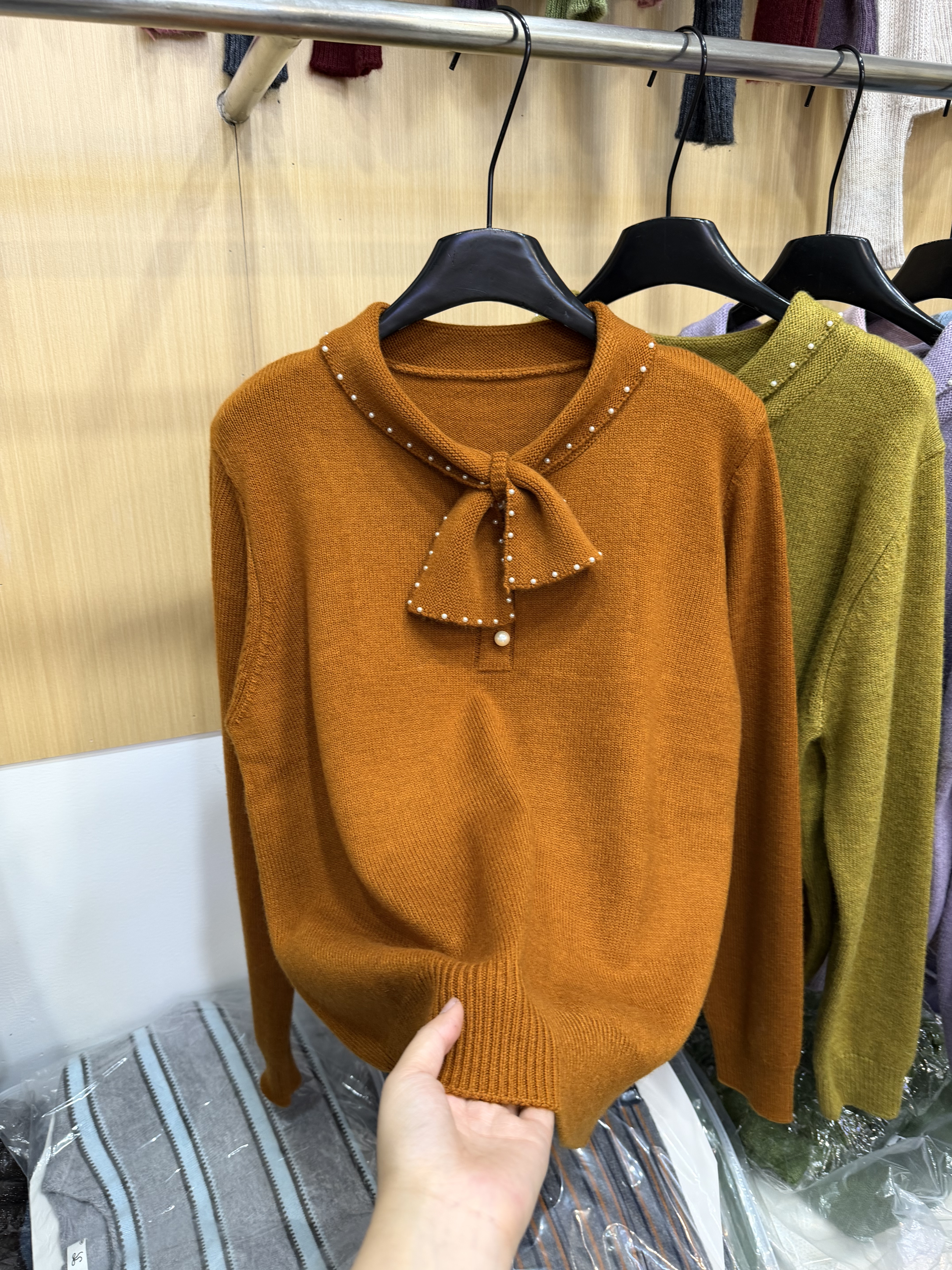 韩版蝴蝶结钉珠点缀羊毛针织开衫2025秋季新款女温柔洋气毛衣外套