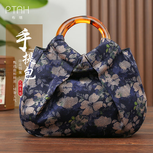 布塔手提包碎花藏青中优雅