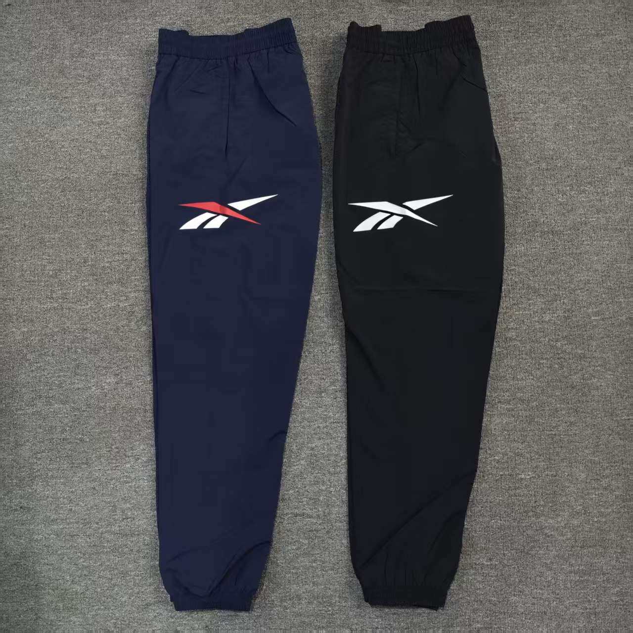 REEBOK锐步复古男子大LOGO梭织双层运动收脚长裤24SRM617U
