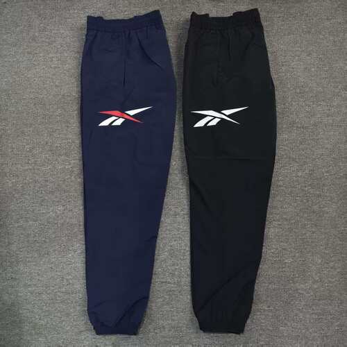 REEBOK锐步复古男子大LOGO梭织双层运动收脚长裤24SRM617U