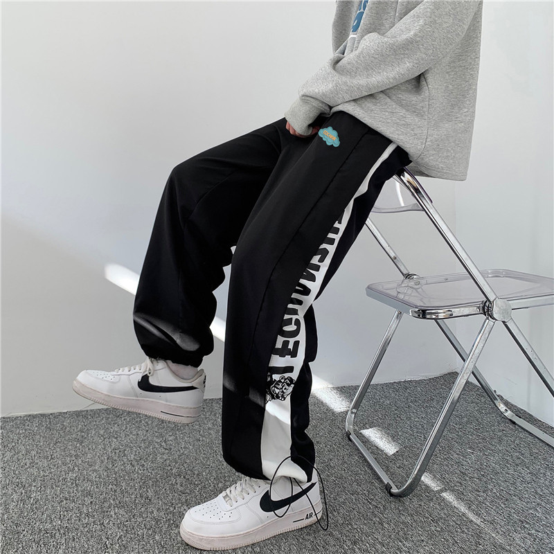 港风秋冬款男直筒宽松拼接字母卡通印花休闲九分裤h200图片