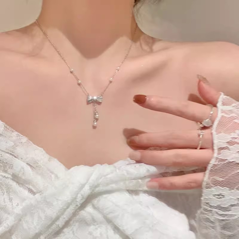 珍珠蝴蝶结流苏钛钢项链配饰女轻奢小众锁骨链高级感颈链2024新款