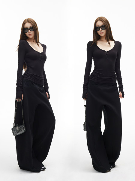 Black fitted long-sleeve top and wide-leg pants worn by a model