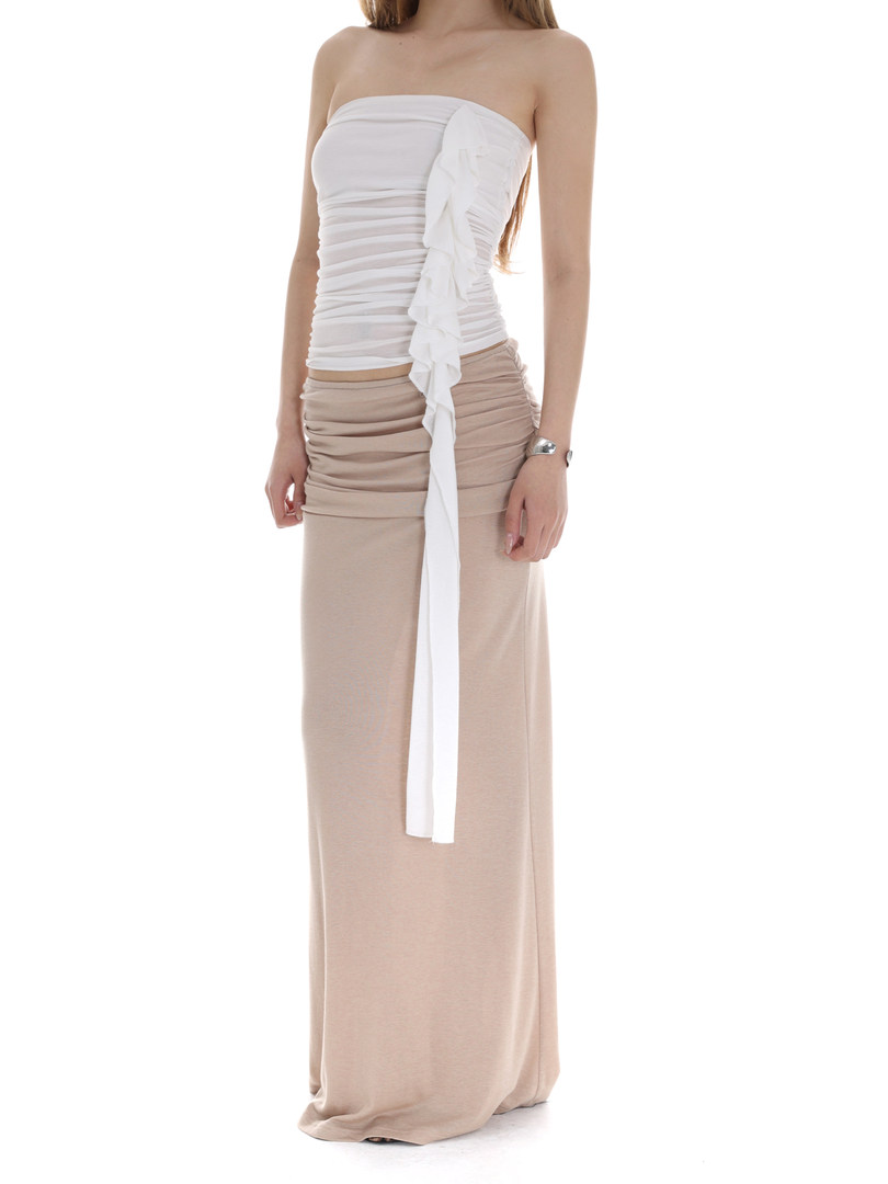 Model wearing a strapless white and beige long dress