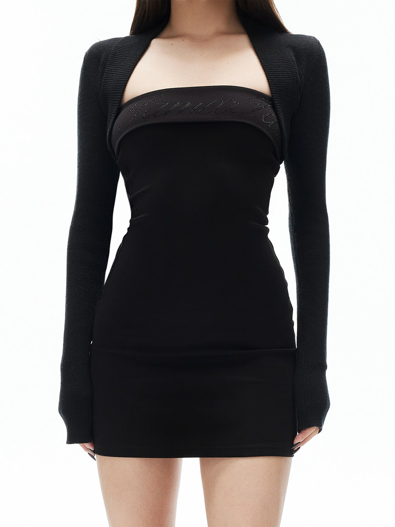 Black long-sleeve mini dress worn by a model