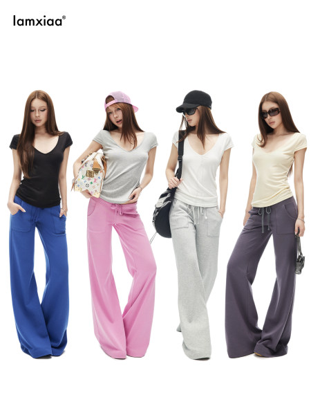 Models wearing colorful wide-leg casual pants and fitted short-sleeve tops
