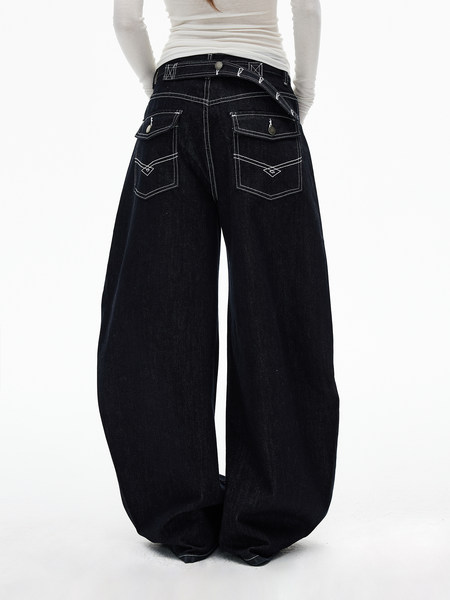 Black wide-leg jeans worn by a model on a white background