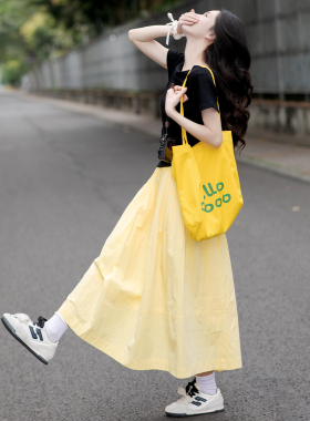 黄色韩版半身裙女2026夏季新款通勤少女高腰中长款松紧腰a字伞裙
