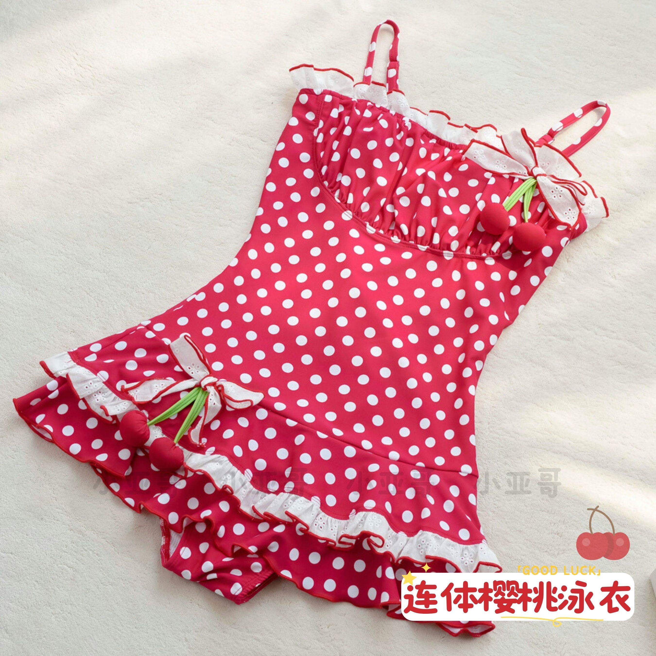 少女可爱樱桃波点波浪裙摆泳衣图片