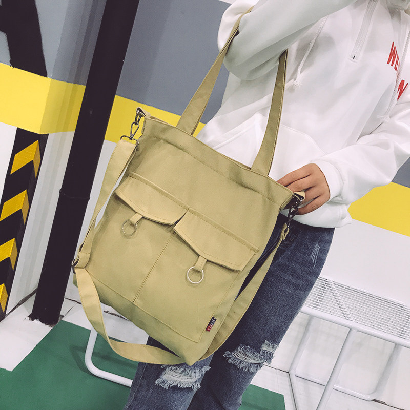 休闲帆布通勤女包新款铁环双兜百搭单肩斜跨手提包学生补习书包袋