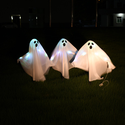 Halloween props, colorful lights, small ghosts, black and w