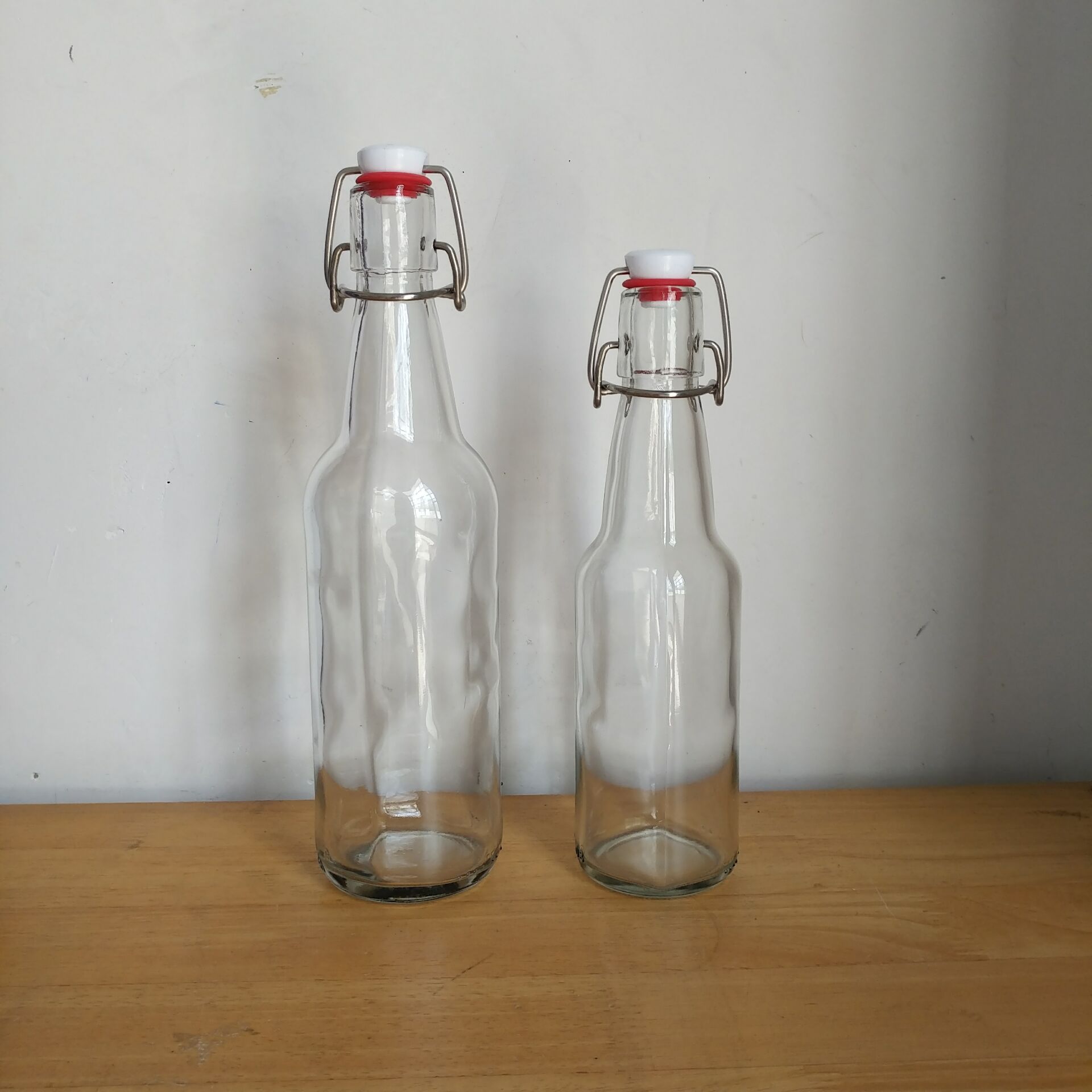 现货330ml 500ml透明带盖卡扣玻璃瓶密封罐摇摆啤酒瓶孝素乐扣瓶