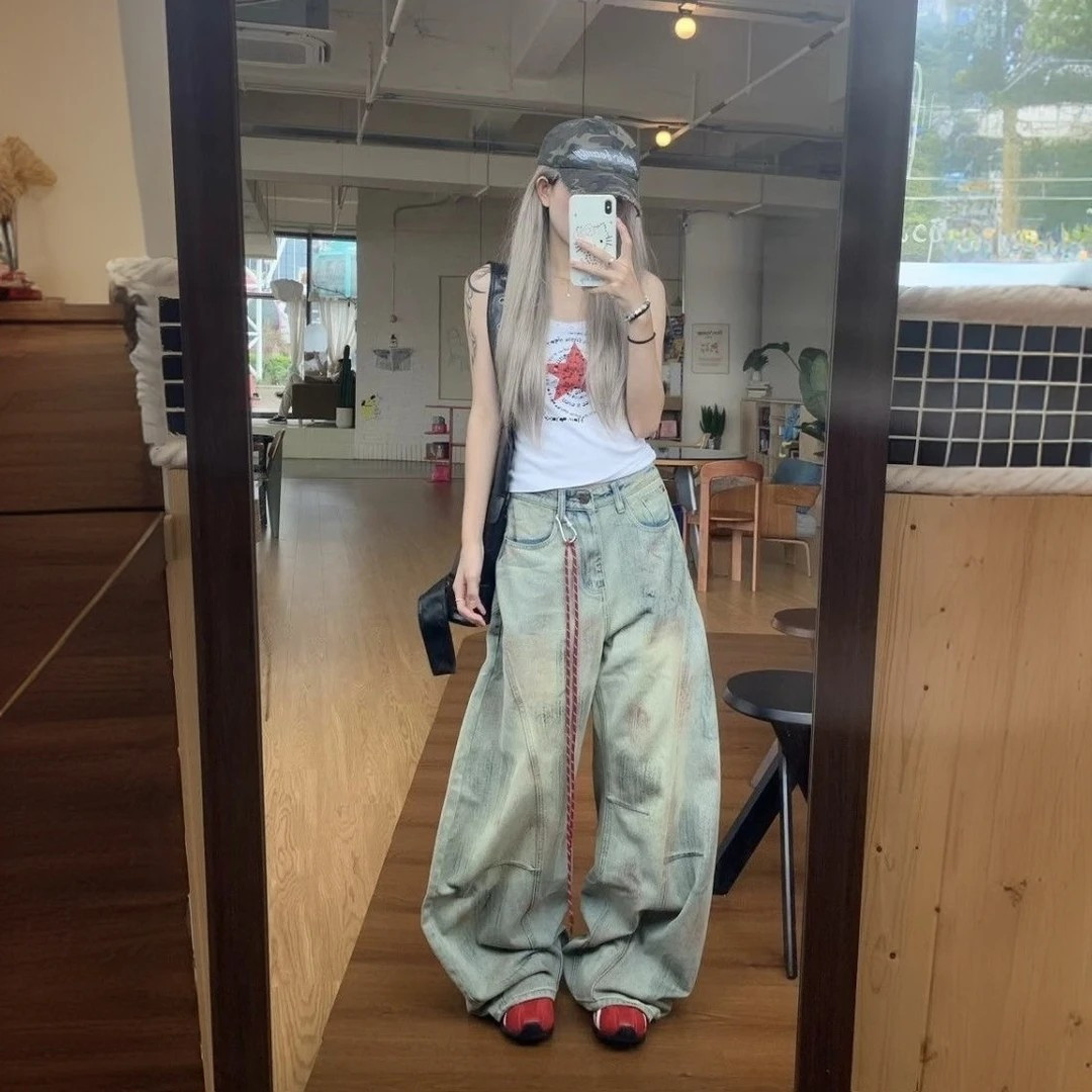 复古高街脏染做旧解构弯刀牛仔裤图片