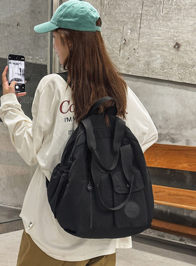 大容量双肩包女多功能通勤背包男学生书包2026新款简约黑色旅行包