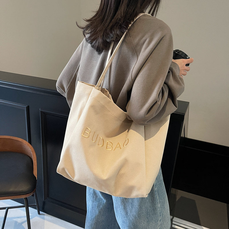 刺绣字母帆布托特包女2025新款大容量学生单肩包休闲百搭手提布袋,箱包皮具/热销女包/男包,托特包,淘宝优惠券,粉丝福利购,淘宝优惠卷