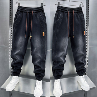 男士秋冬季加绒黑灰色牛仔裤松紧腰拼接小脚裤潮牌弹力束脚哈伦裤