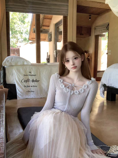 Model wearing a light lavender ribbed knit top with a white tulle skirt