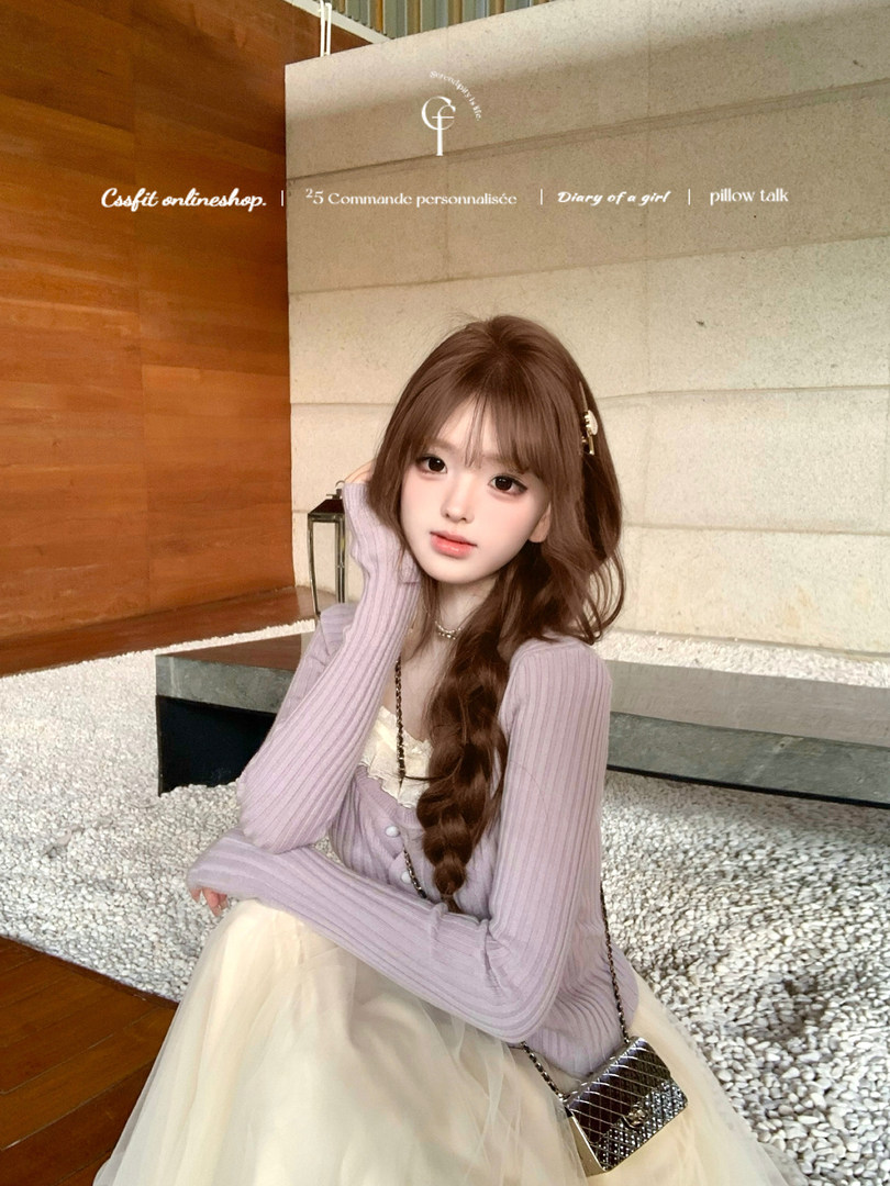 Woman wearing a lavender ribbed long-sleeve top with a cream tulle skirt