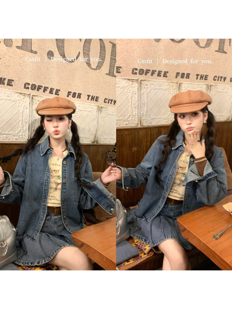 Model wearing a blue denim jacket and skirt set with a tan beret