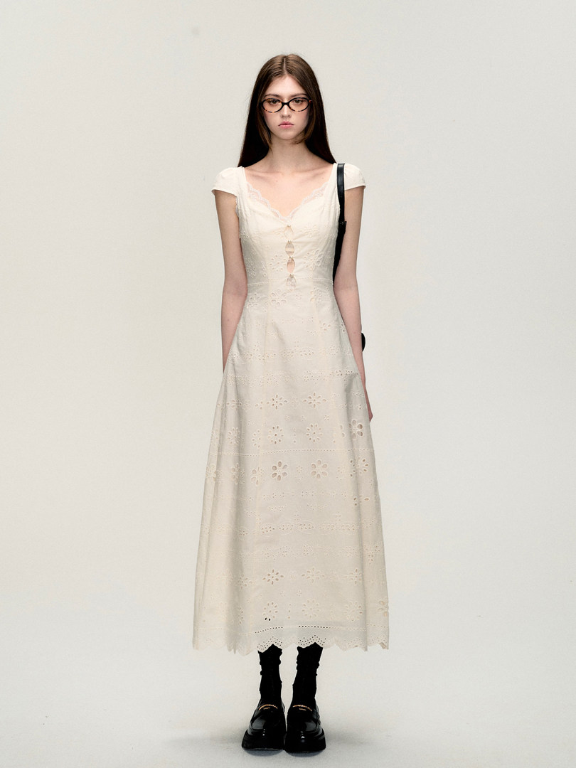 Cream eyelet midi dress worn on a model