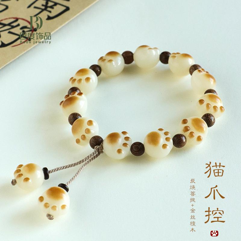 新品白玉菩提根炭烧招财猫爪手链女金丝檀木流苏红玛瑙手串
