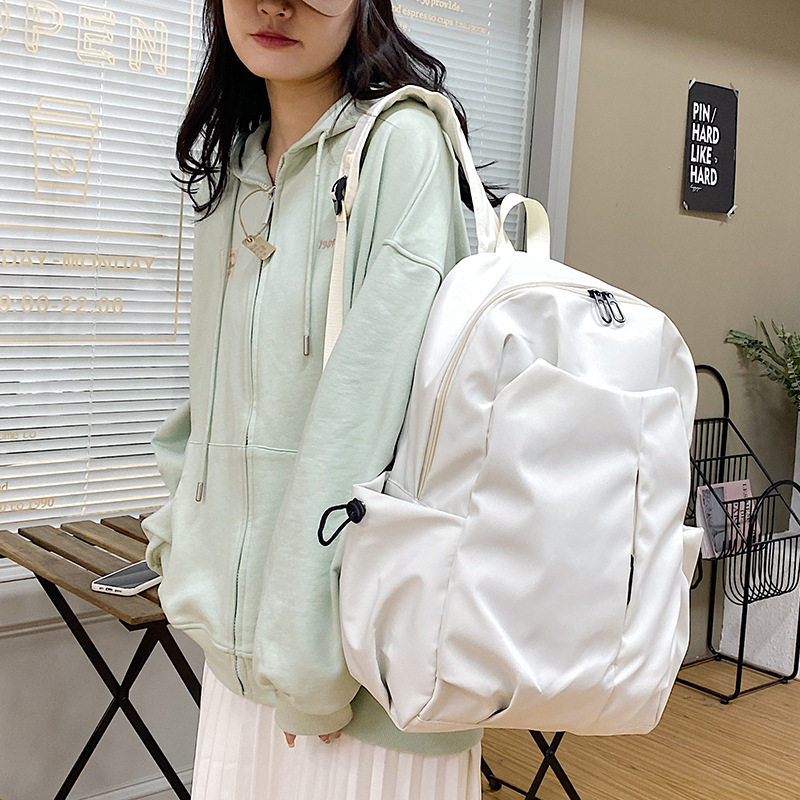 大学生书包情侣款韩版休闲背包女冬季新款纯色简约质感纯色双肩包