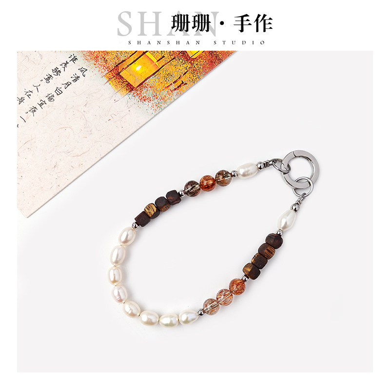 天然奇楠沉香手机链珍珠手拿链黑晶超七腕链包包挂件手链高端挂绳