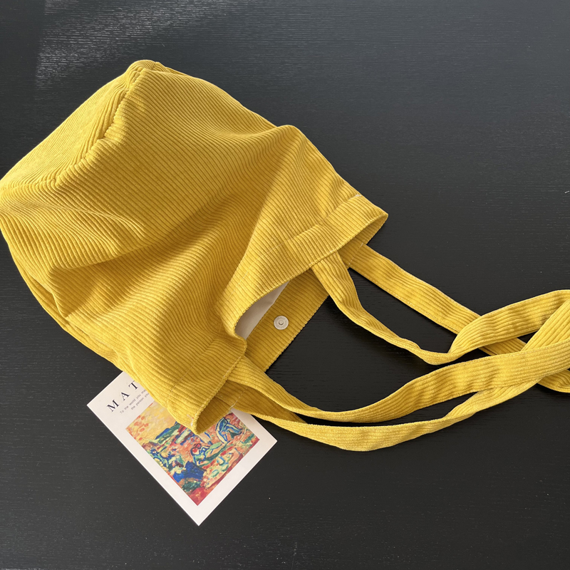 秋冬新款亮黄色灯芯绒圆筒包单肩包小众设计大容量立体水桶包女包