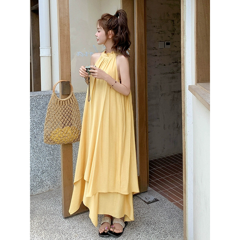 法式度假风气质黄色挂脖连衣裙女2025夏季显瘦露肩层叠大摆裙长裙