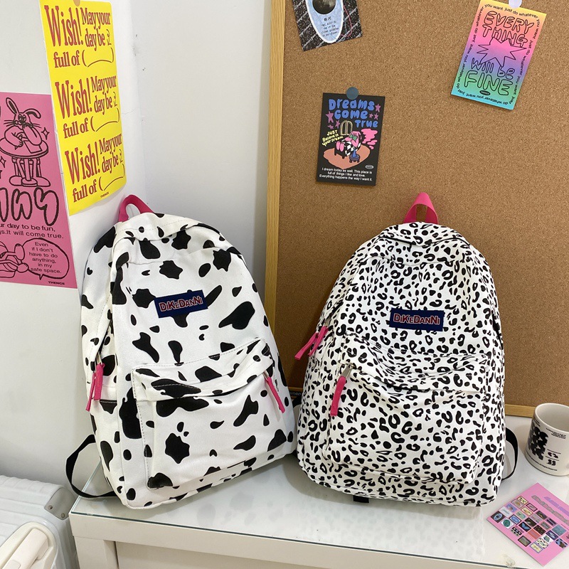 日系原宿风休闲帆布奶牛纹豹纹双肩包ins高中大学生书包女潮背包