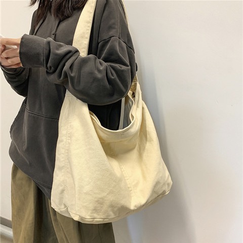 2025新款日系街头潮流斜挎包男女ins原宿潮牌复古帆布单肩包学生