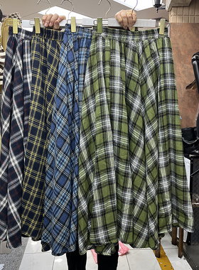 绿色磨毛格纹口袋半身裙女2025秋冬新款宽松显瘦不规则大裙摆长裙