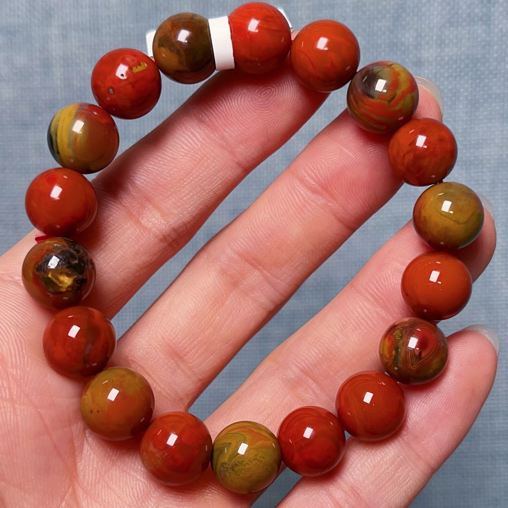 3703F104大山包南红三彩包浆单圈手串