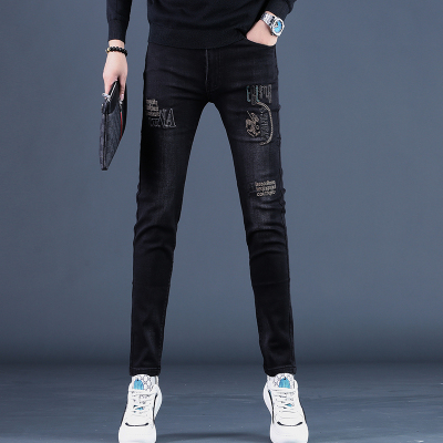 秋季款2025新款紧身刺绣牛仔裤男士修身加绒潮牌黑色小脚裤子潮