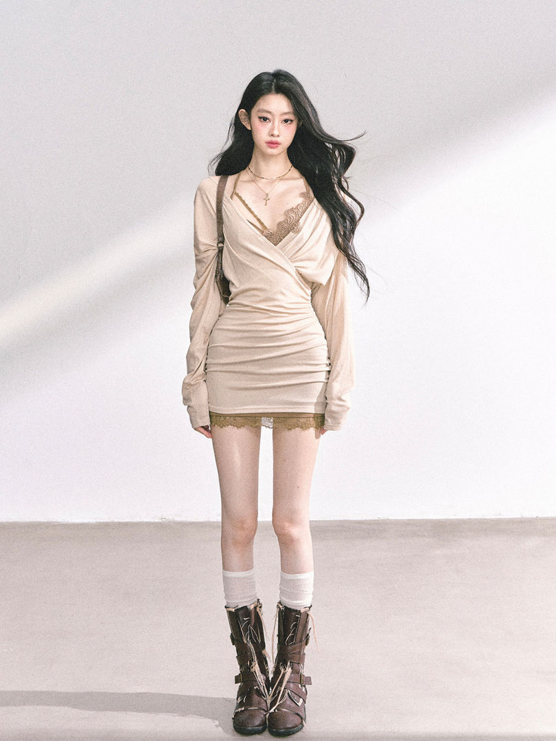 Beige ruched wrap mini dress worn by a model