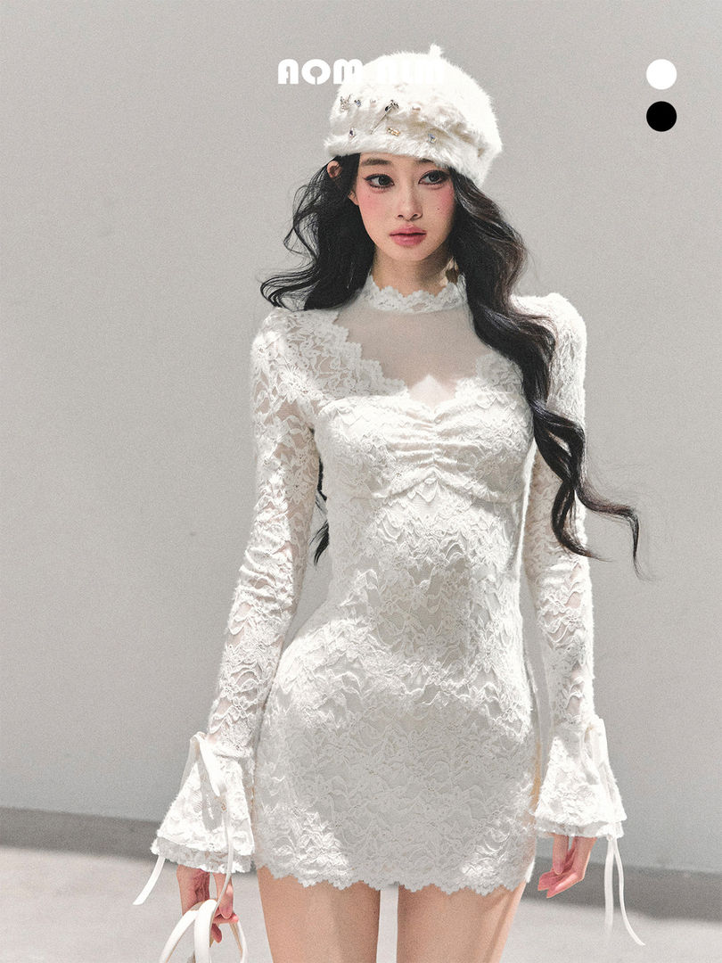 White lace long-sleeve mini dress worn with a white fur hat